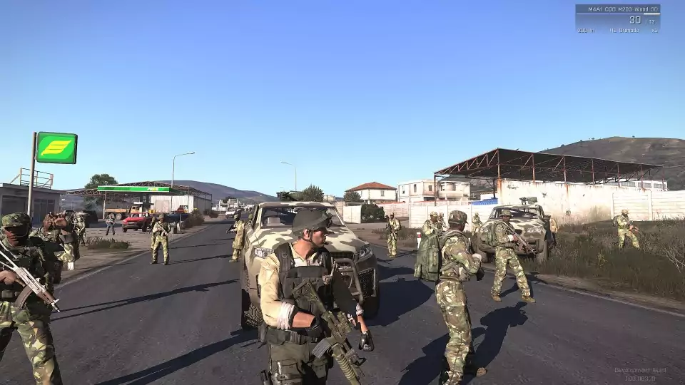 Patrolling near a gas station in the Arma 3 computer game.