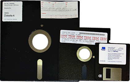 Computer floppy disks. a 8", 5 1/2" and a 3.5" floppy disk.