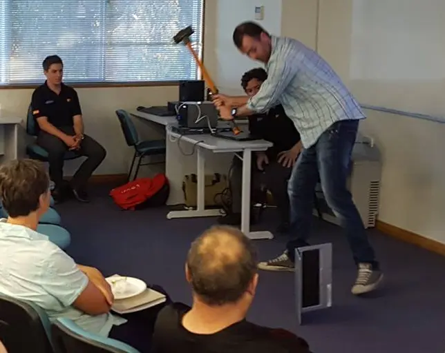 Smashing a macbook with a sledge hammer.